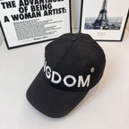 Black cap with 'KINGDOM' embroidery and small circular logo on side