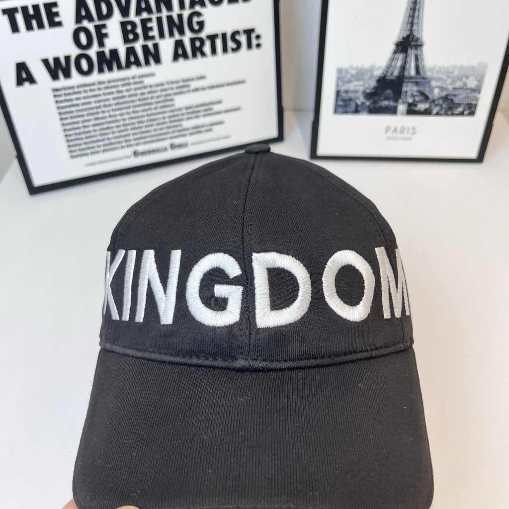 Black cap crown detail with 'KINGDOM' stitched lettering across front