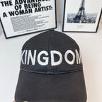Black cap crown detail with 'KINGDOM' stitched lettering across front