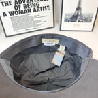 Gray cap interior with branded tags attached under brim