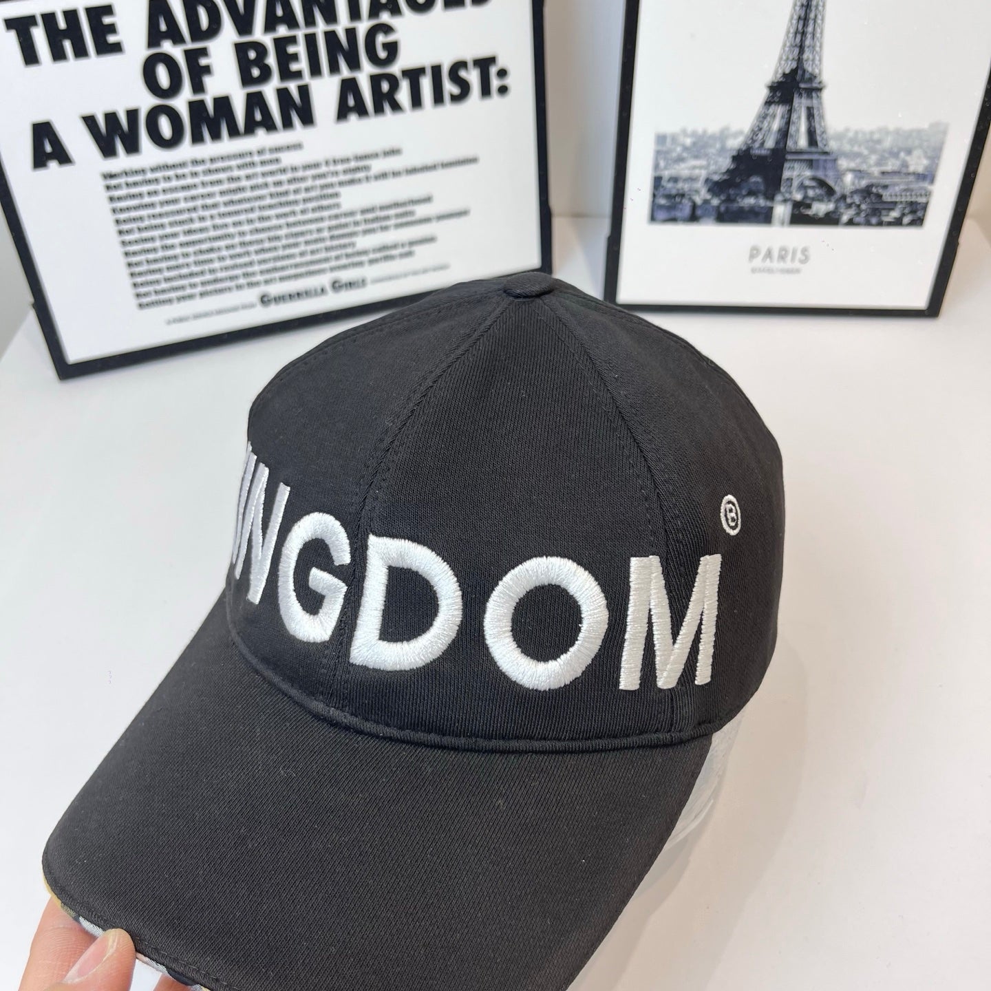 Black cap with KINGDOM embroidery and small circular logo