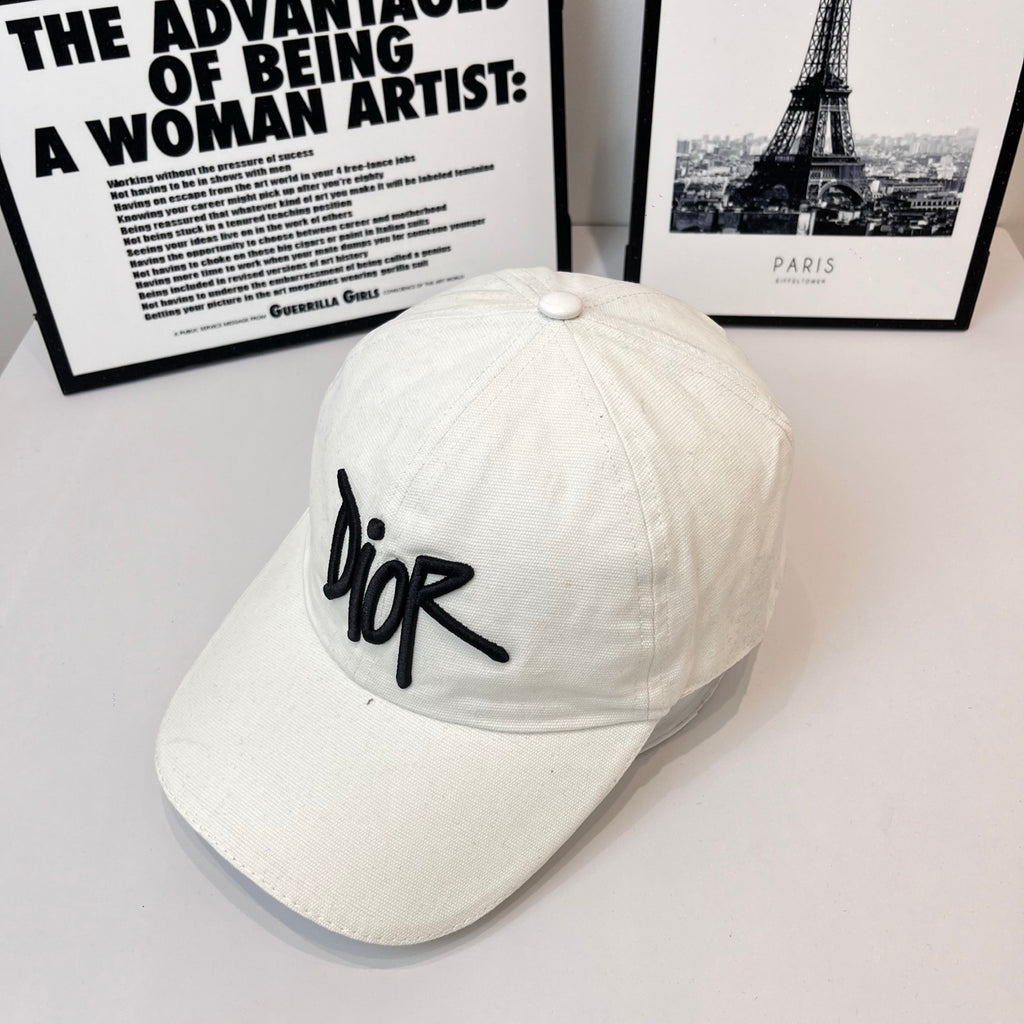 White canvas cap with black Dior logo on front panel.