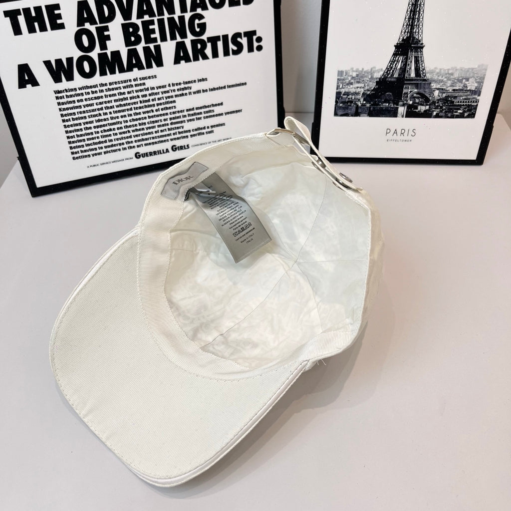 White canvas cap inside view with hanging tag and curved brim.