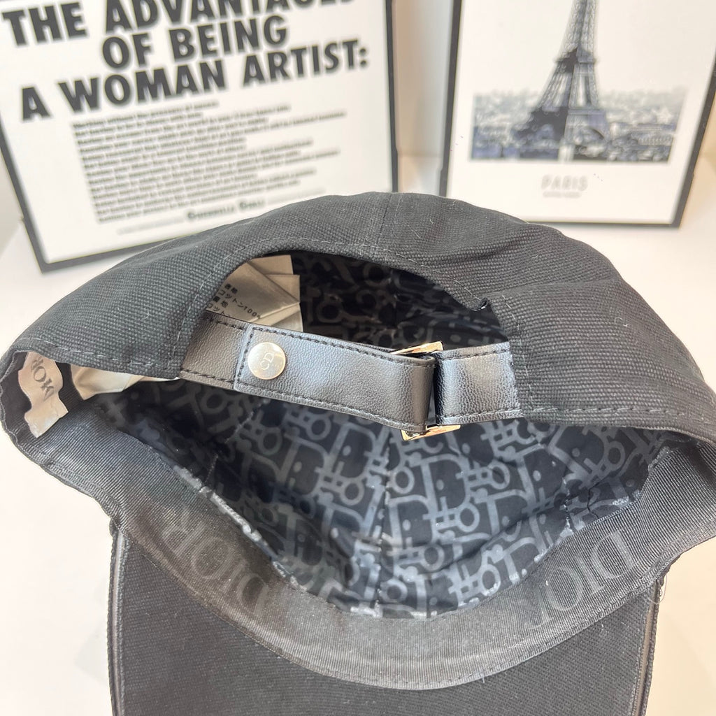 Cap interior with dark patterned lining and adjustable strap
