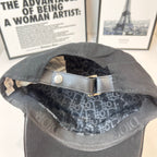 Cap interior with dark patterned lining and adjustable strap