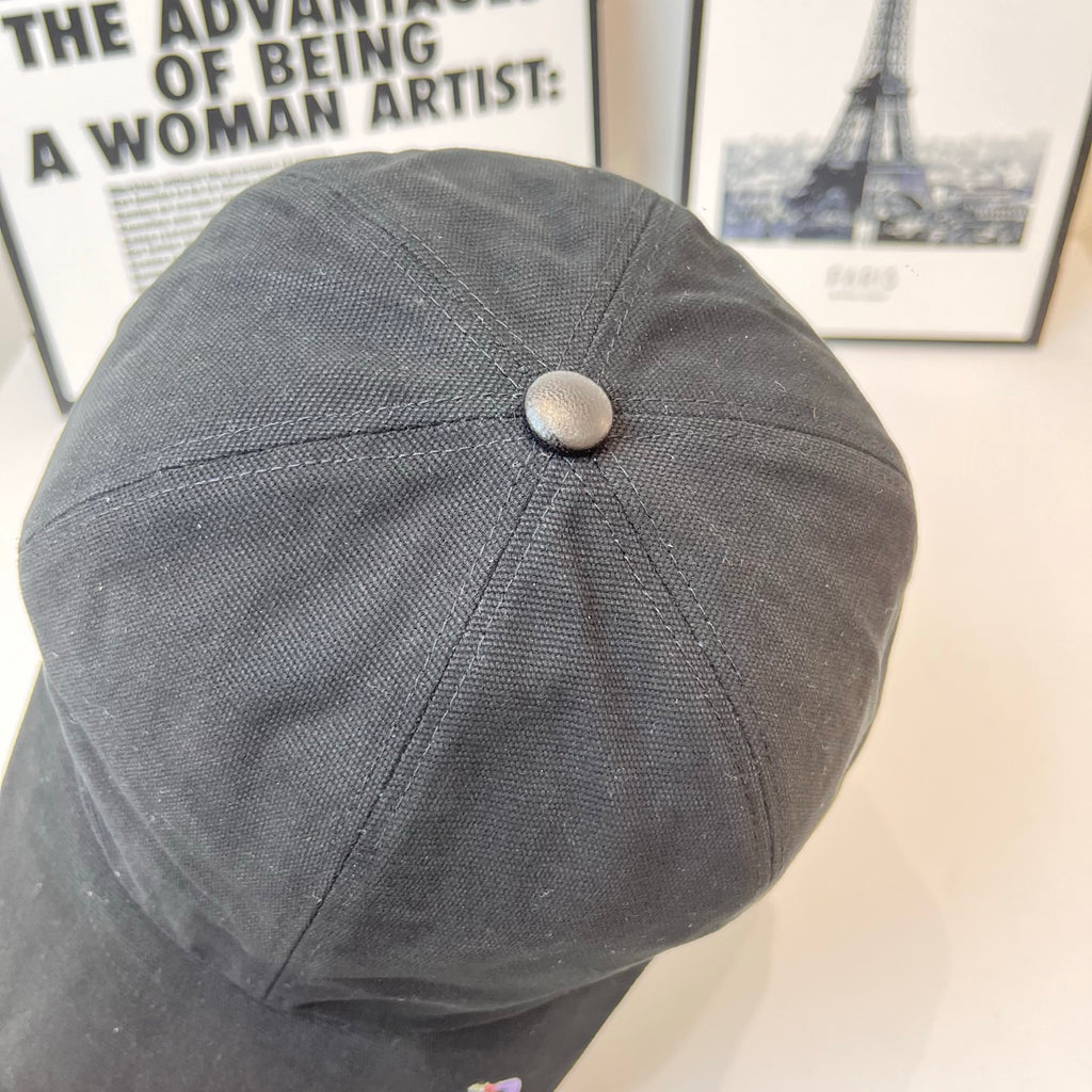 Gray baseball cap with round top button and curved brim