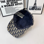 Dior cap with navy-and-cream logo print, back view with interior tags.