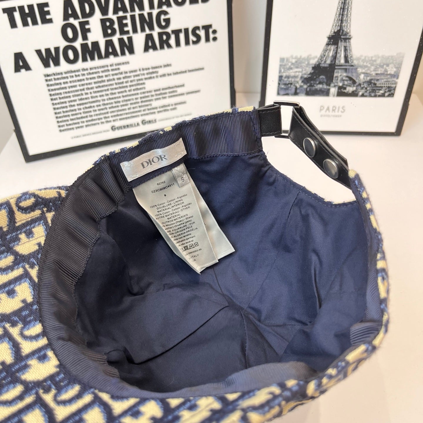 Dior cap interior lining with label and adjustable strap, open crown view.