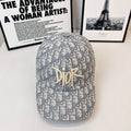 Dior monogram cap in blue-and-gray with gold Dior logo front