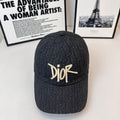 Dior monogram cap in dark navy with gold-tone Dior logo on the front