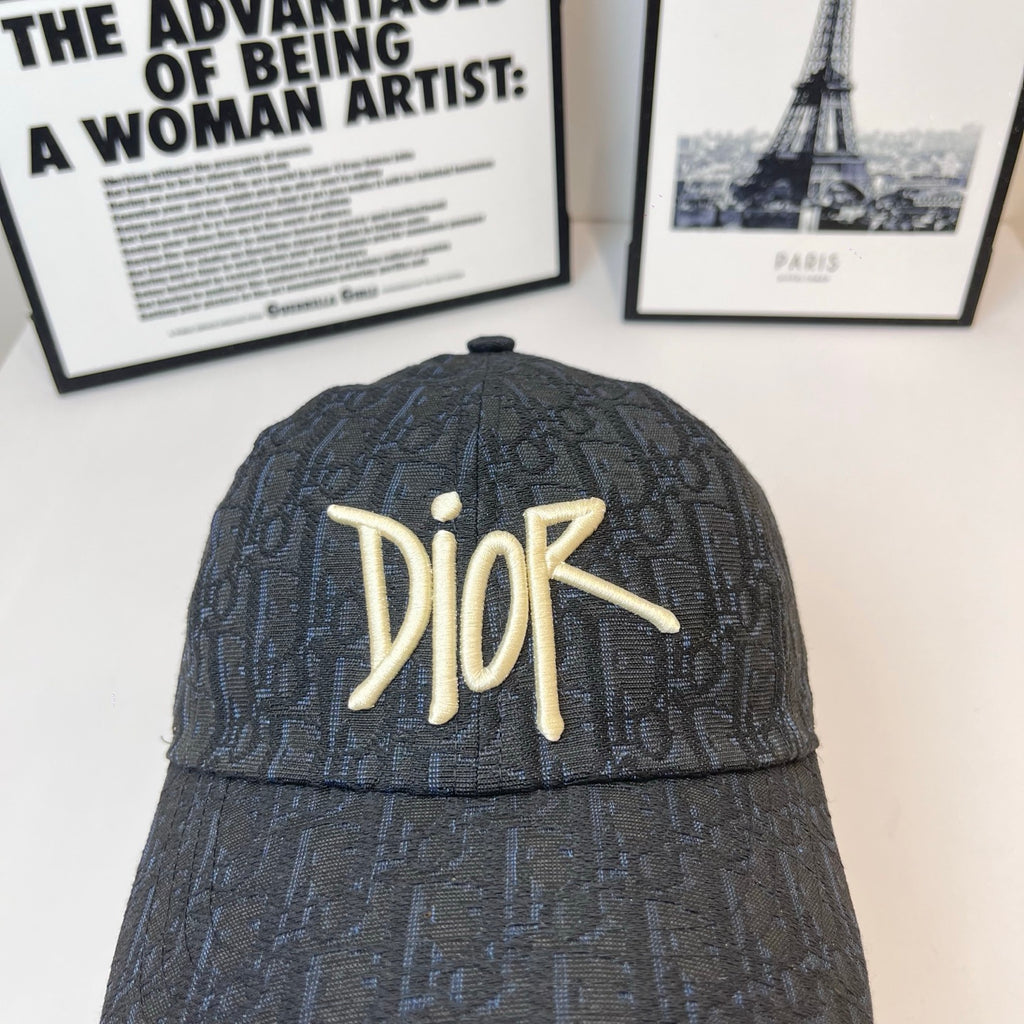 Dior monogram cap in dark navy with gold-tone Dior logo, close front view