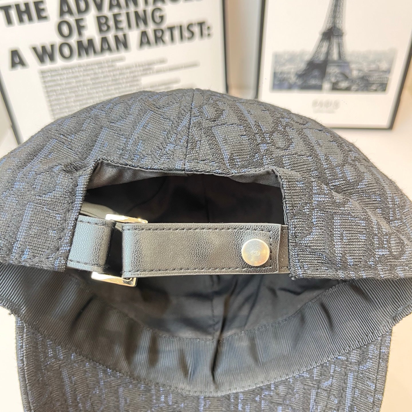 Dior monogram cap back with adjustable strap and metal buckle, close-up