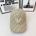 Dior cap in beige monogram fabric with raised Dior logo embroidery at front.