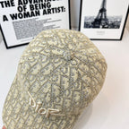 Dior cap in beige monogram fabric with raised Dior logo embroidery, rear view.
