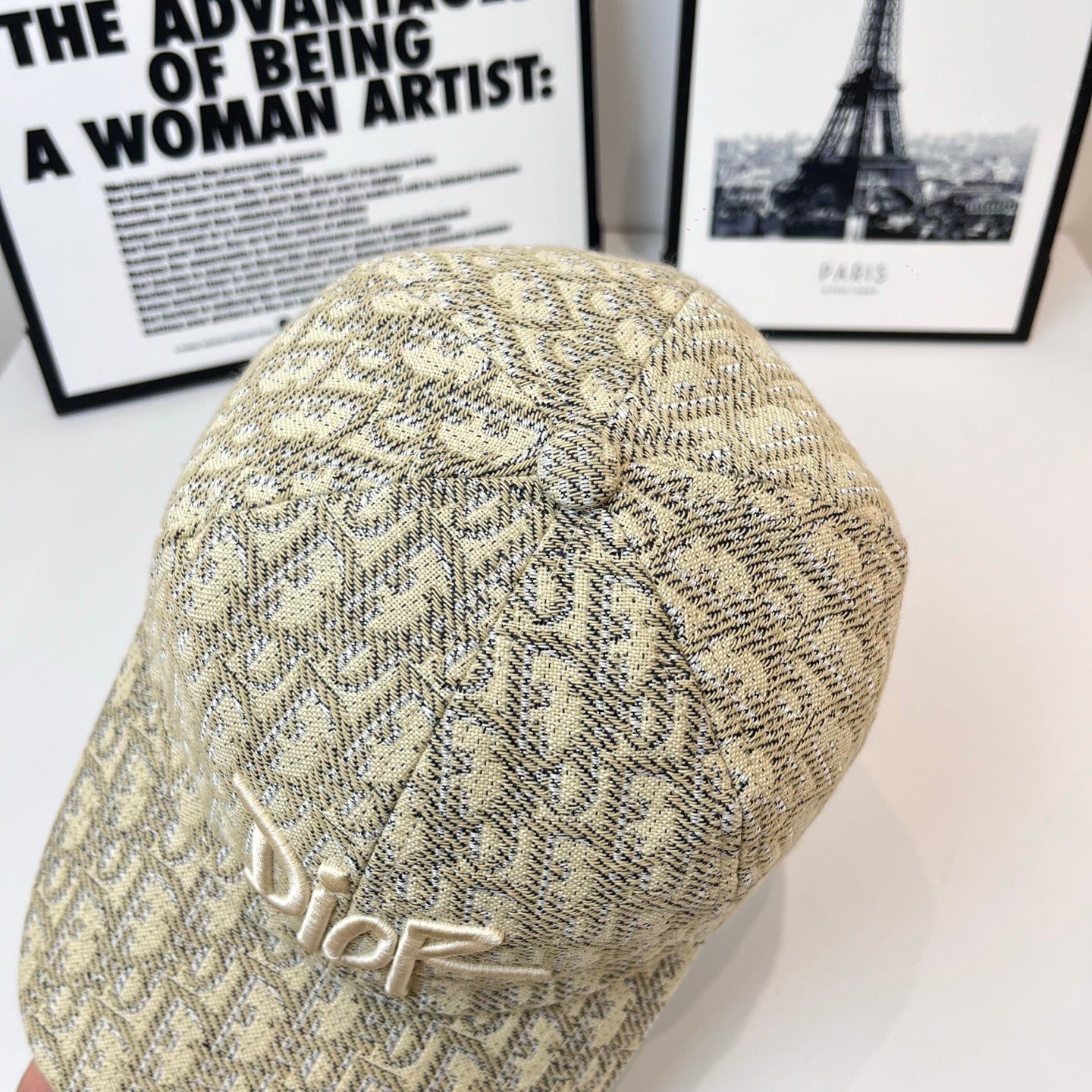 Dior cap in beige monogram fabric with raised Dior logo embroidery, rear view.