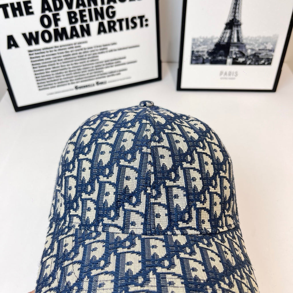 Dior baseball cap with domed top and blue-and-white monogram print, curved brim.