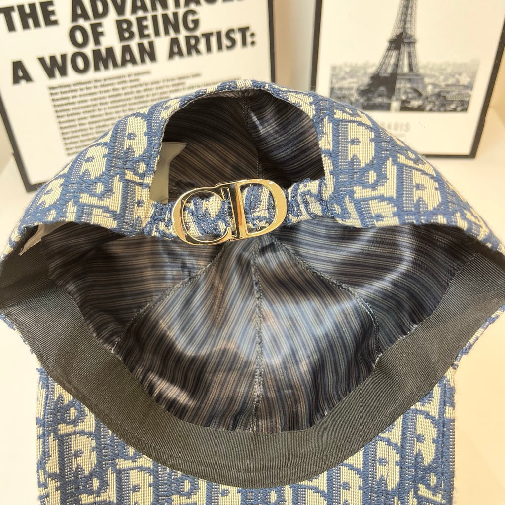 Dior cap interior with adjustable strap and gold CD clasp; blue monogram exterior.