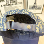 Dior cap interior with light-blue strap and gold-tone logo button closure