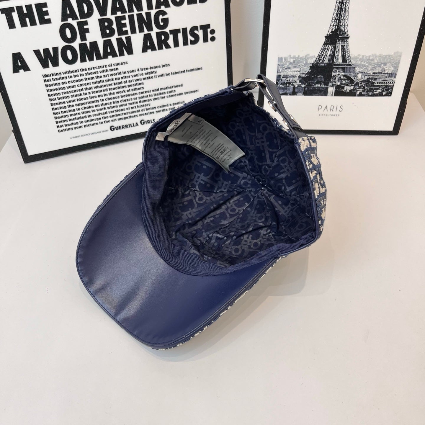 Dior cap with curved brim and dark-blue interior lining, side view