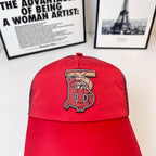 Red baseball cap with front embroidered monogram logo on crown
