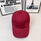 Burberry red cap with curved brim and small embroidered crest on the front