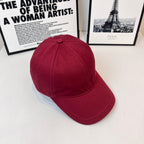 Burberry red cap with curved brim and stitched seam detailing on the crown