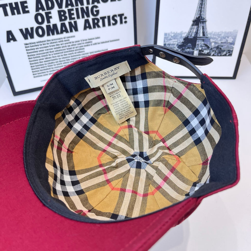 Burberry cap interior with plaid lining, dark underside, and fabric brand label