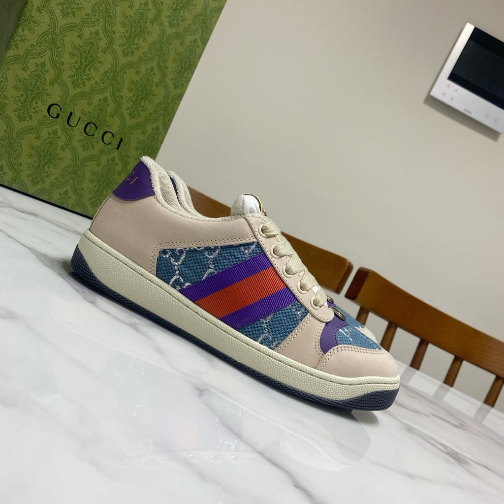 Gucci unisex sneakers with cream leather, blue canvas, and rainbow web stripe