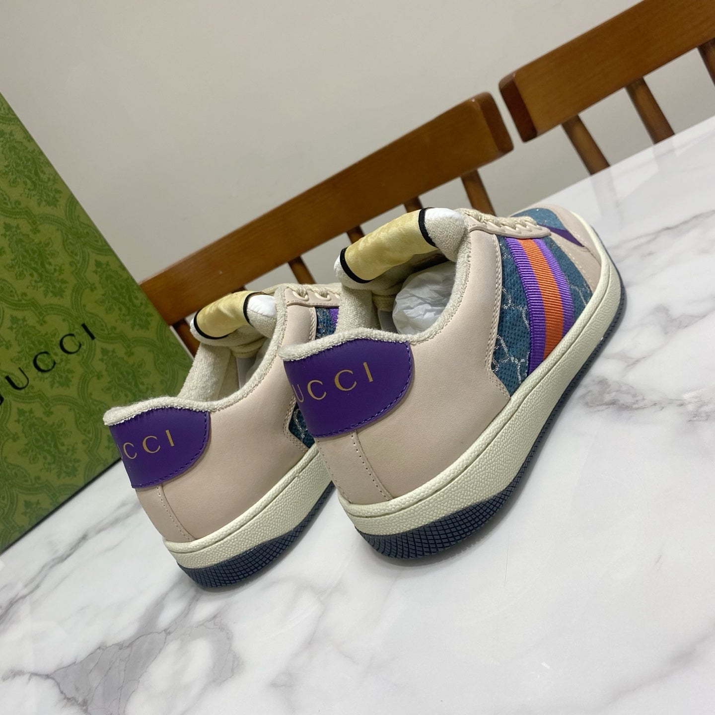 Cream Gucci unisex sneakers with purple heel accents and web stripe trim