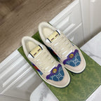 Cream Gucci unisex sneakers with plush lining and rainbow side stripe