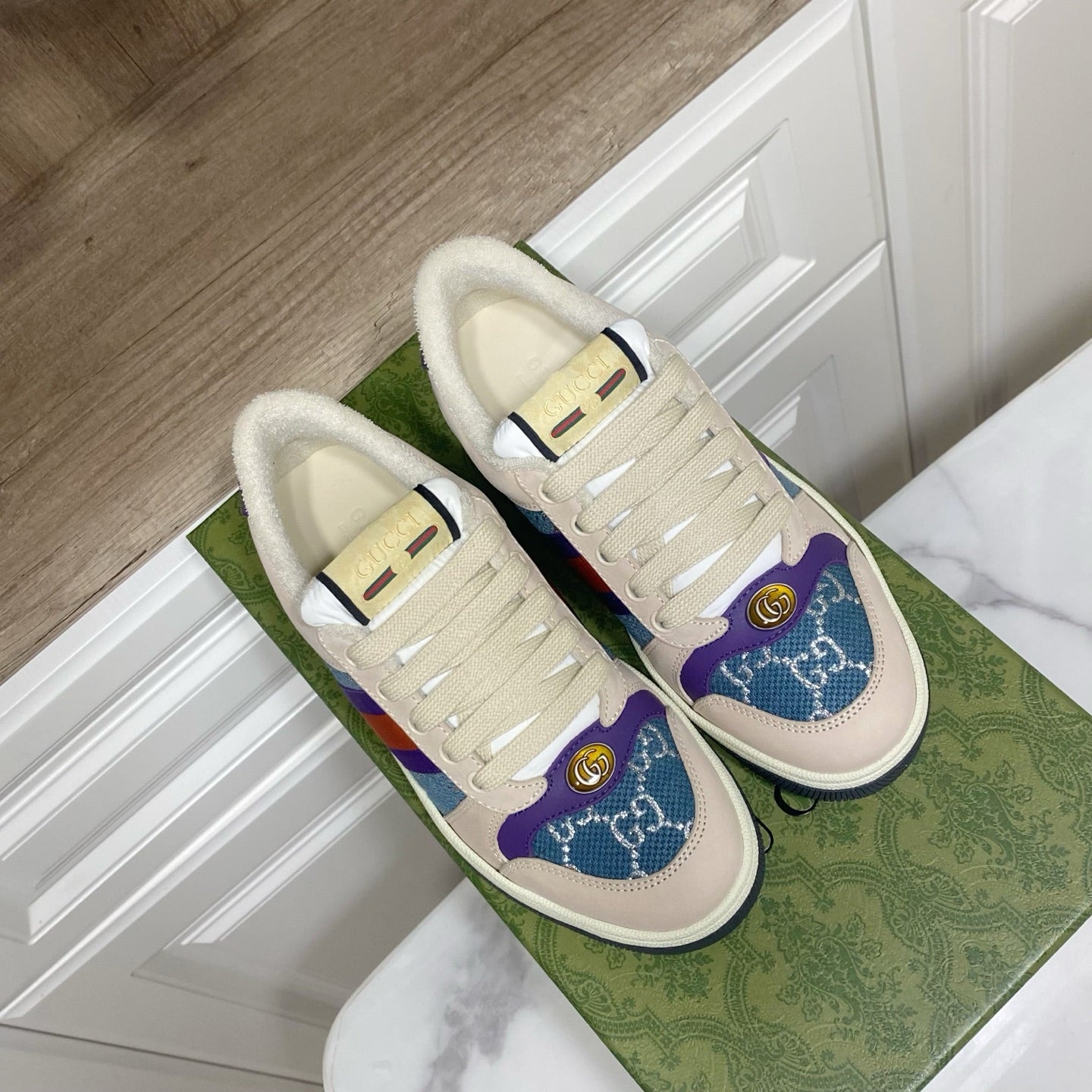 Cream Gucci unisex sneakers with plush lining and rainbow side stripe