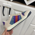 Cream Gucci unisex sneaker with blue patterned side and multicolor web stripe