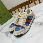 Cream Gucci unisex sneakers with blue, purple, and red web stripe side panels