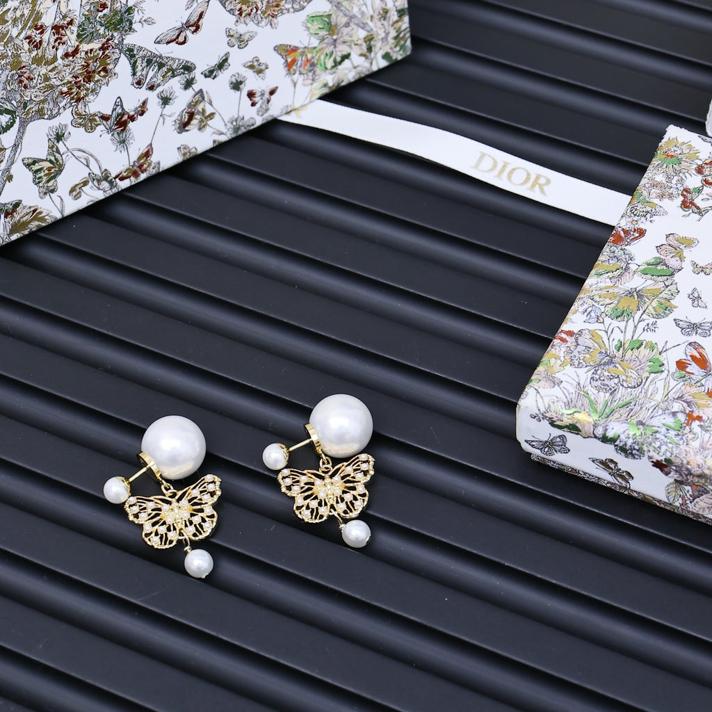 Dior gold tone earrings with round white pearls and small charms