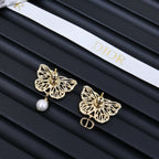 Dior gold-tone butterfly earrings with pearl drops