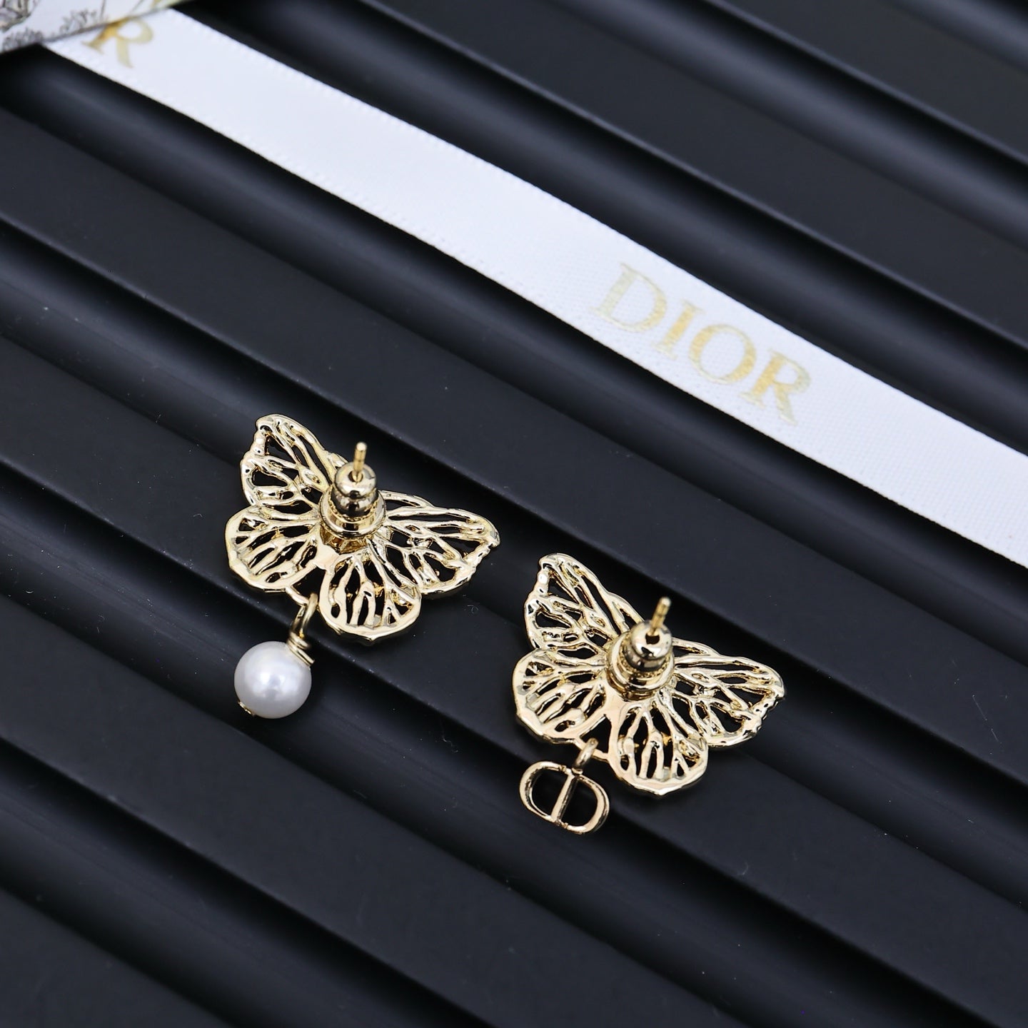 Dior gold-tone butterfly earrings with pearl drops