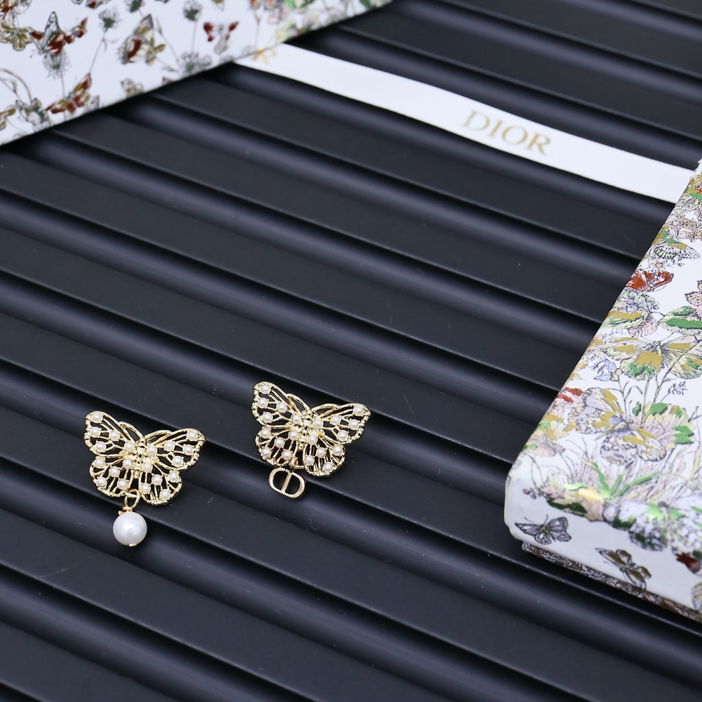 Dior gold-tone butterfly stud earrings with pearl drop accents