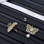 Dior gold-tone earrings: butterfly, cross, and hoop with pearls