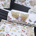 Dior gold-tone butterfly earrings with pearls and rhinestones