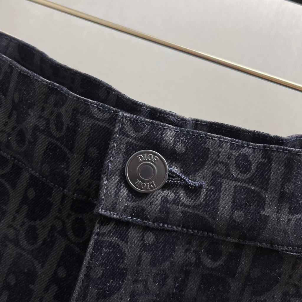 Dior emblem button on dark patterned shorts waistband