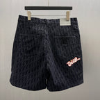 Dior logo shorts with red and white embroidered logo on front
