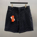 Dior logo-pattern shorts in dark navy with front button and zipper closure