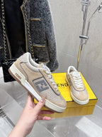 Fendi unisex sneakers shown on box, beige suede with FENDI logo on side