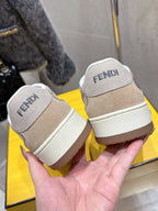 Fendi unisex sneakers heel view, beige uppers with white sole and FENDI text tab