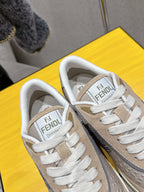 Fendi unisex sneakers close-up of tongue, beige uppers with white laces and FENDI