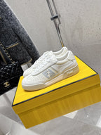Fendi unisex sneakers, white leather, side profile with logo patch and clean lace-up