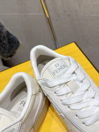 Fendi unisex sneakers, white leather, close-up of laces and tongue logo