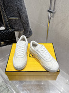 Fendi unisex sneakers, white leather, pair on display with lace-up and embossed sole