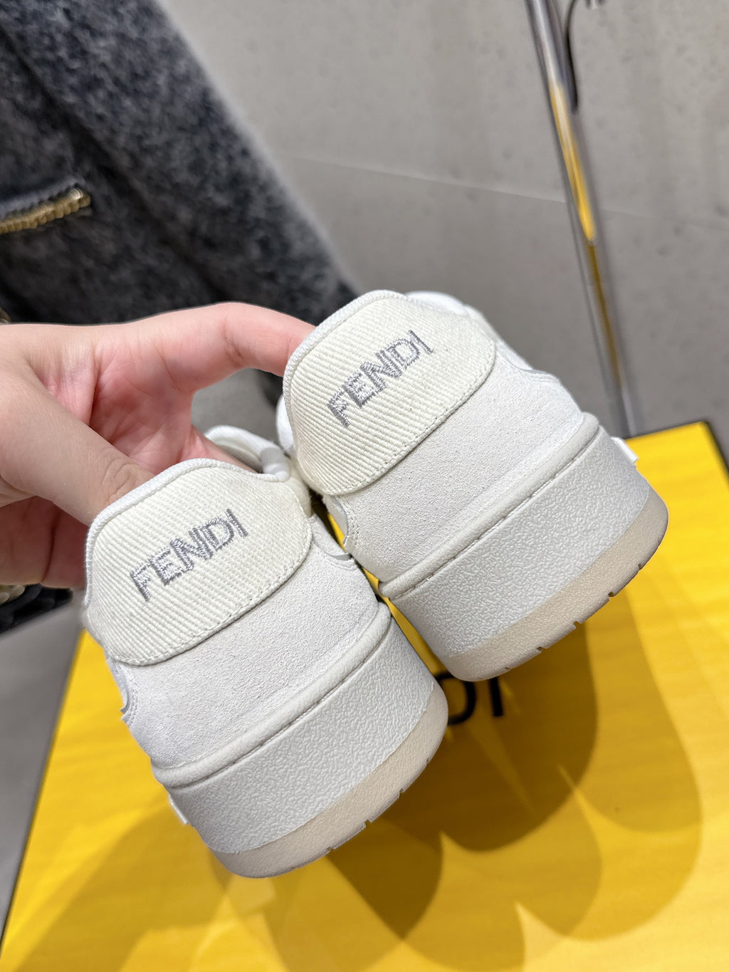 Fendi unisex sneakers, white leather, close-up of padded ankle cuffs and logo