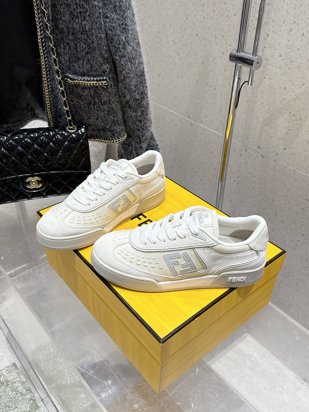 Fendi unisex sneakers, white leather, side and front view with lace-up and logo